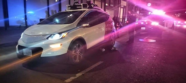 A Chevy Bolt operated by Cruise LLC, driving autonomously, appears to be on top of victim&rsquo;s leg in photo taken by bicycle delivery person at the scene the night of October 2, 2023 and was published in the SF Chronicle. The crash occurred on Fifth Street between Market and Mission streets by the Westfield mall. Photo: Austin Tutone, SF Chronicle